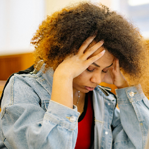 A woman holding her face on each side 